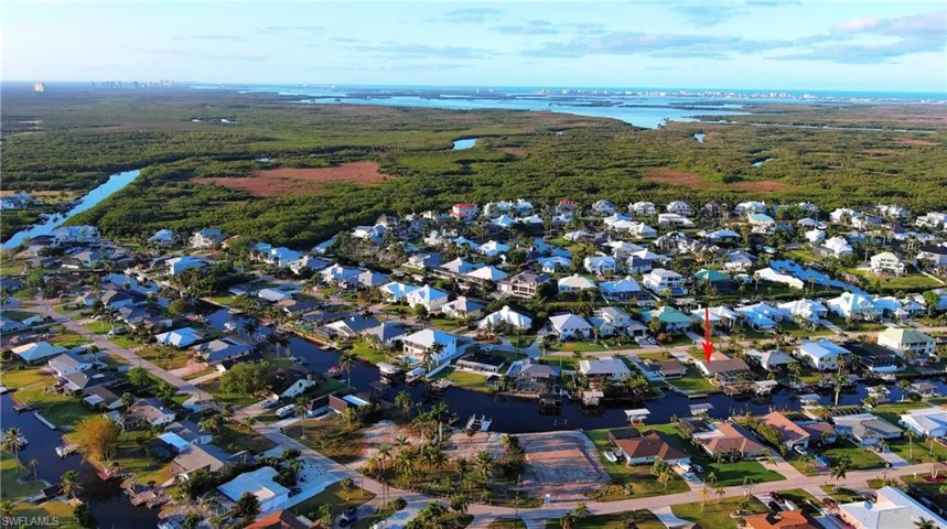 Birds eye view of property featuring a residential view and a water view