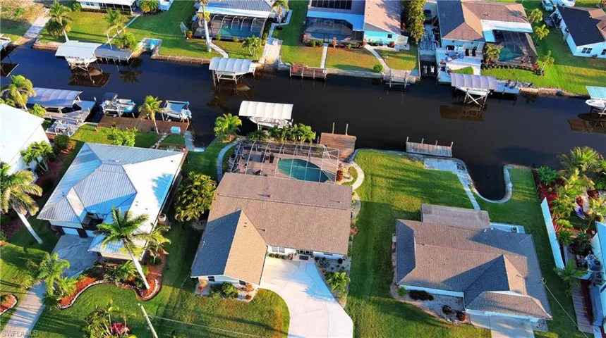 Aerial view with a water view and a residential view