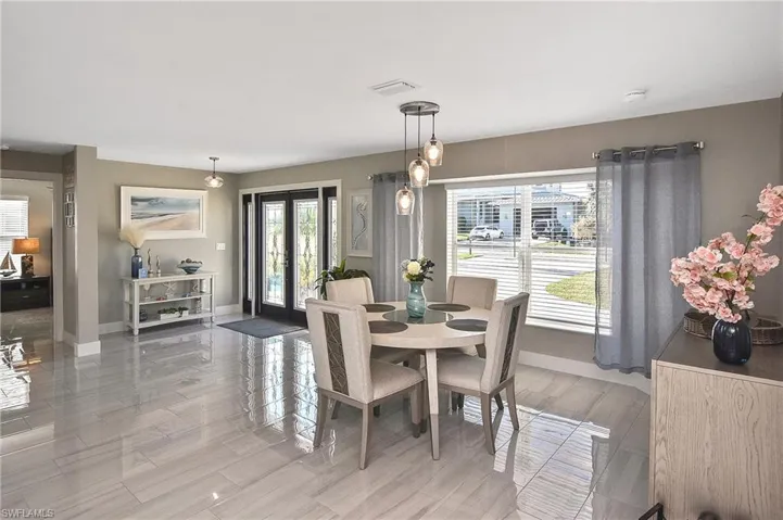 Dining area featuring baseboards and visible vents