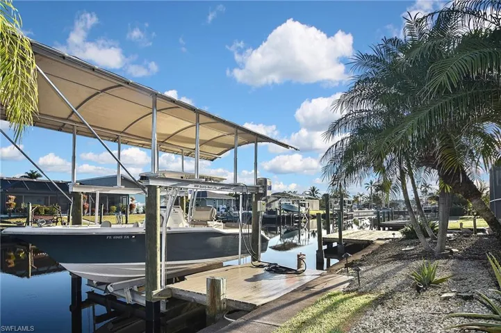 View of dock featuring a water view and boat lift