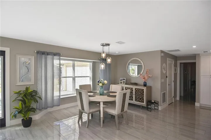 Dining room with plenty of natural light and visible vents