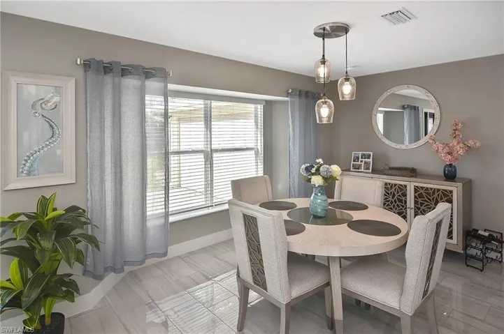 Dining space with baseboards and visible vents