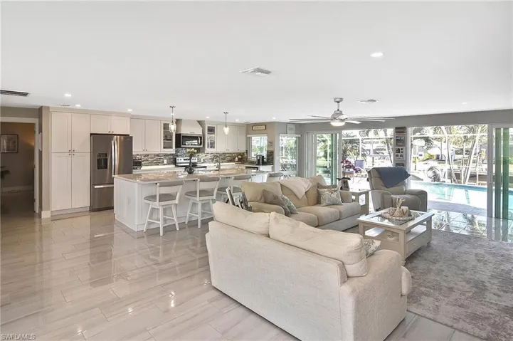 Living room with visible vents, recessed lighting, and a ceiling fan