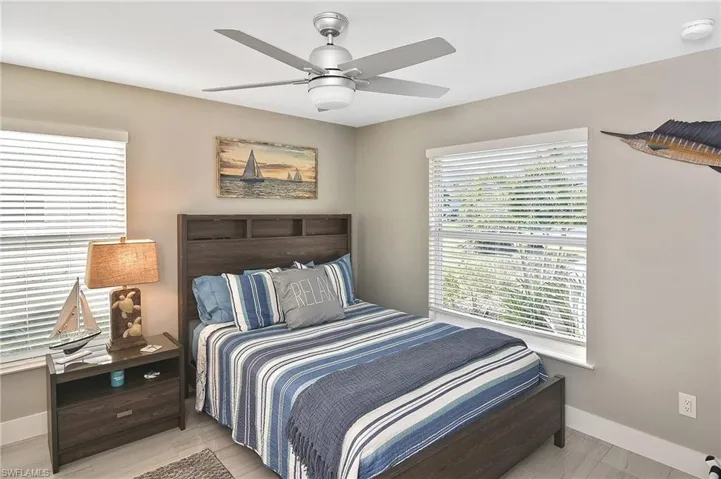 Bedroom featuring baseboards and ceiling fan