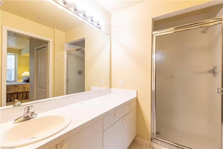Primary bathroom with an enclosed shower and vanity