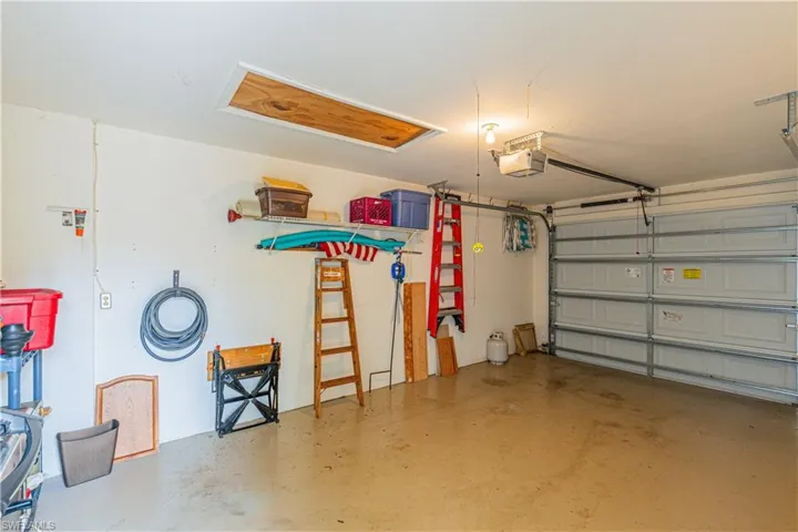 Garage featuring a garage door opener