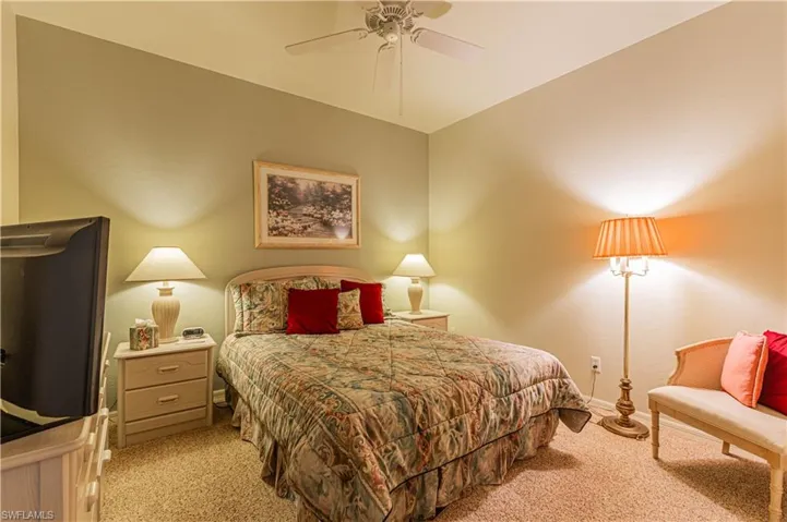 Carpeted bedroom 2 with ceiling fan
