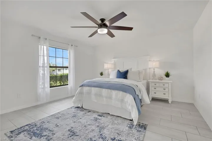 Master bedroom featuring ceiling fan