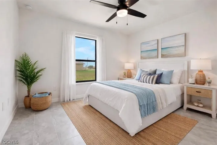 Bedroom featuring ceiling fan and baseboards