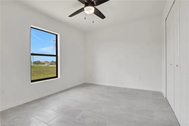 Bedroom featuring a closet and a ceiling fan