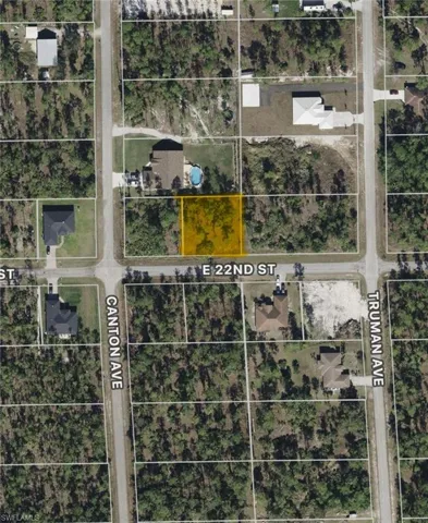 Aerial map of property and surrounding area featuring property boundaries highlighted