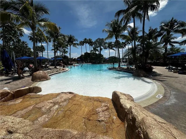 Community pool with a patio area