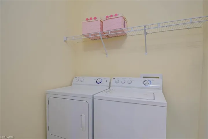Laundry room featuring washer and clothes dryer