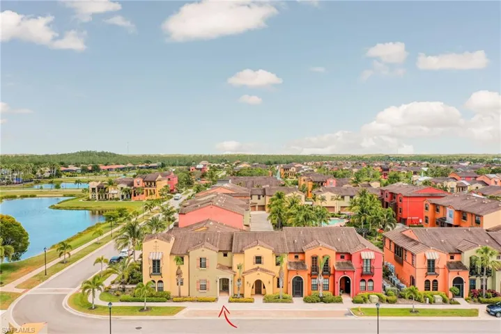 Aerial view of residential area featuring a large body of water