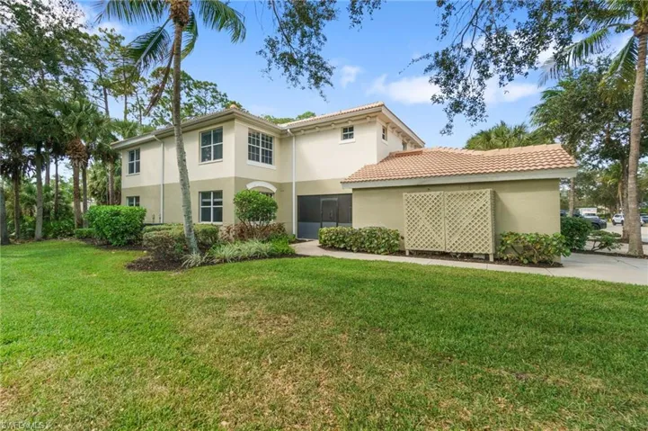 Entry view featuring a large side yard. Perfect for your pooch!
