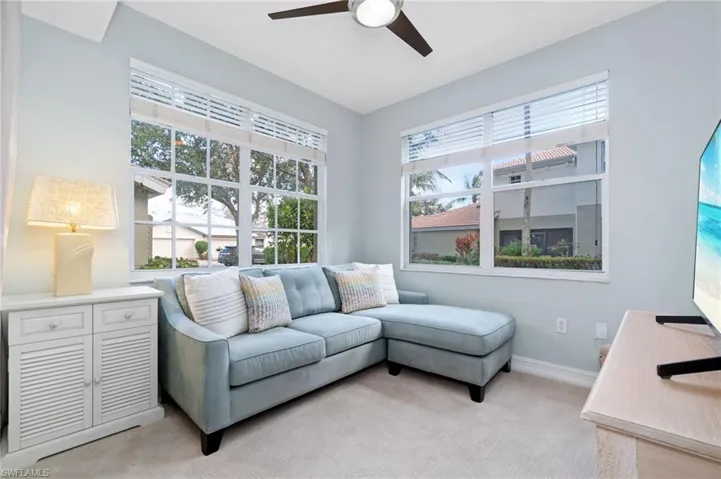 Cozy den with 2 large windows