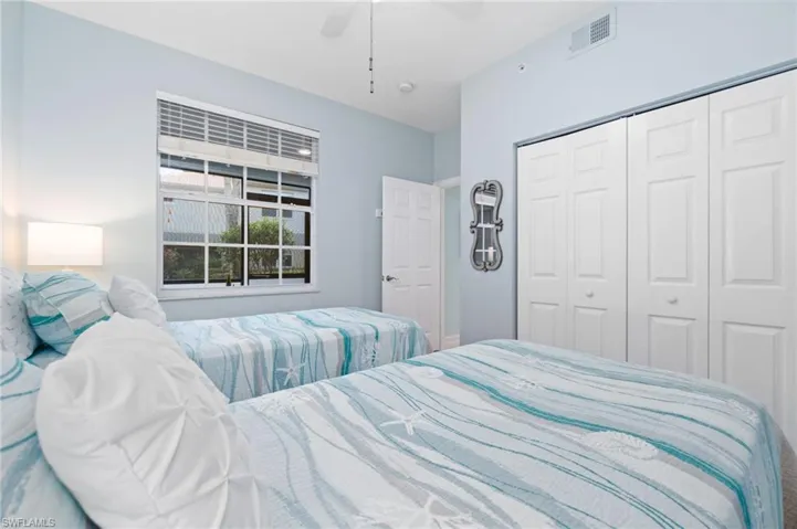 Bedroom featuring a closet and ceiling fan