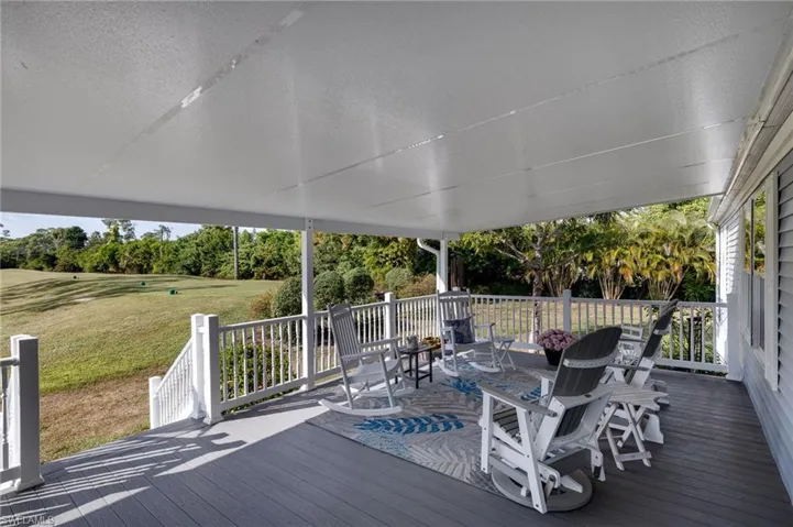 Wooden deck featuring a yard