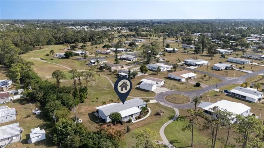 Aerial overview of property's location featuring nearby suburban area