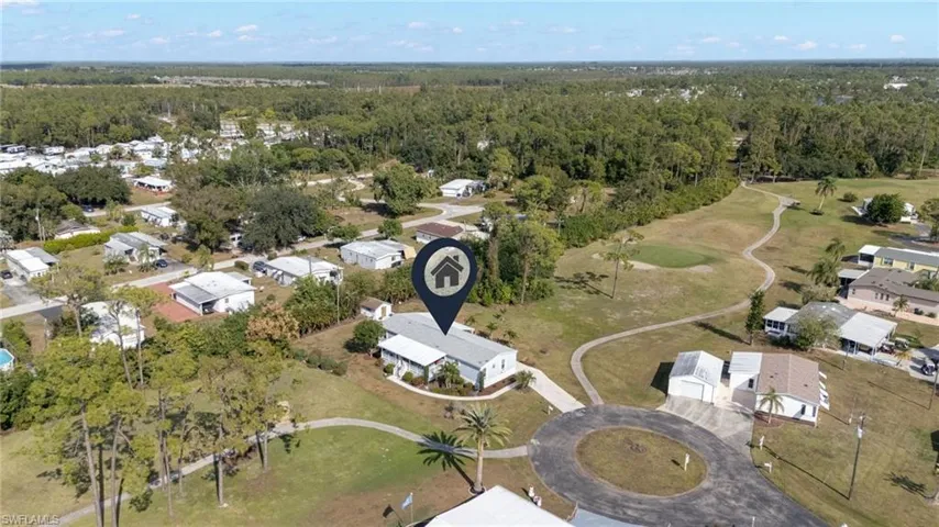 View of property location with nearby suburban area and a golf course