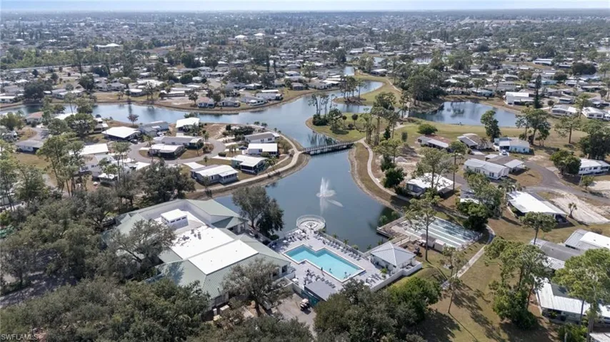 View of property location featuring a nearby body of water and nearby suburban area
