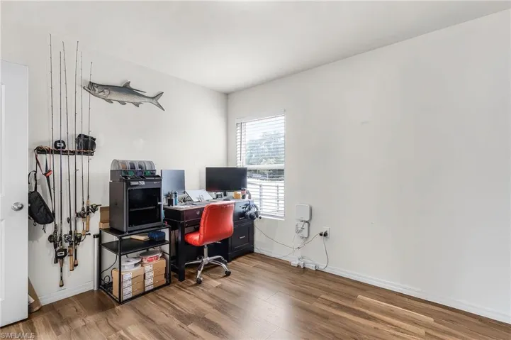 Office area with wood finished floors and baseboards