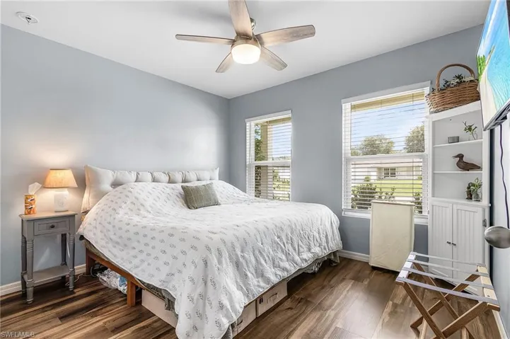 Bedroom featuring dark wood finished floors and ceiling fan