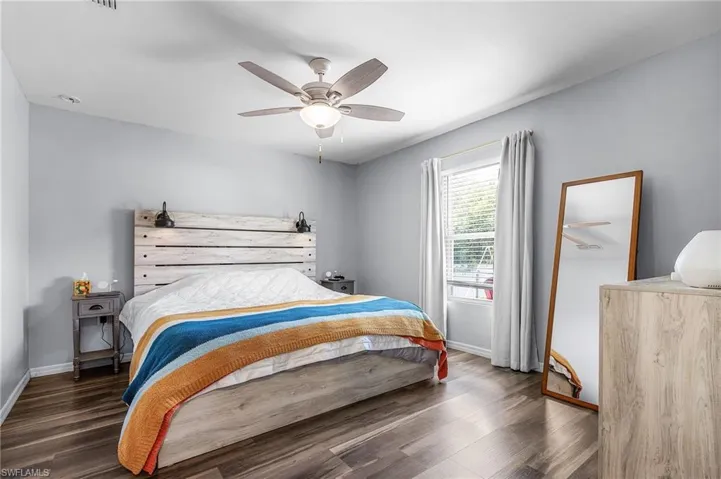 Bedroom with wood finished floors and ceiling fan