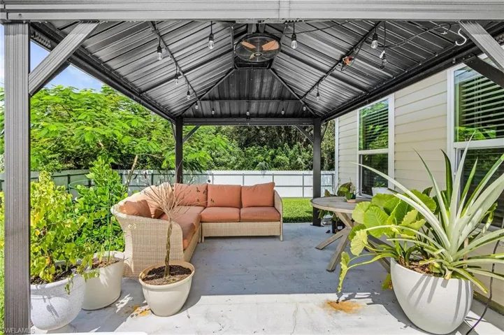 View of patio / terrace featuring an outdoor living space and a gazebo