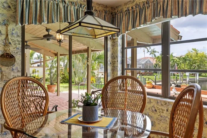 Sunroom with plenty of natural light and ceiling fan
