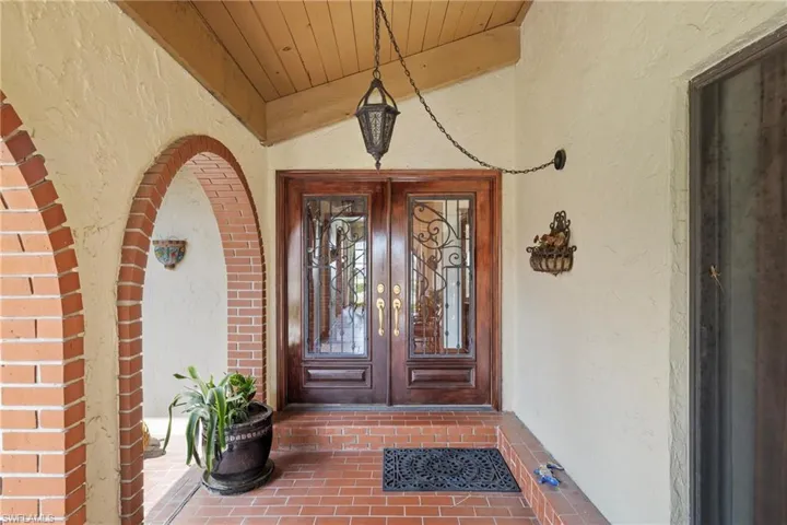 Entrance to property featuring a porch