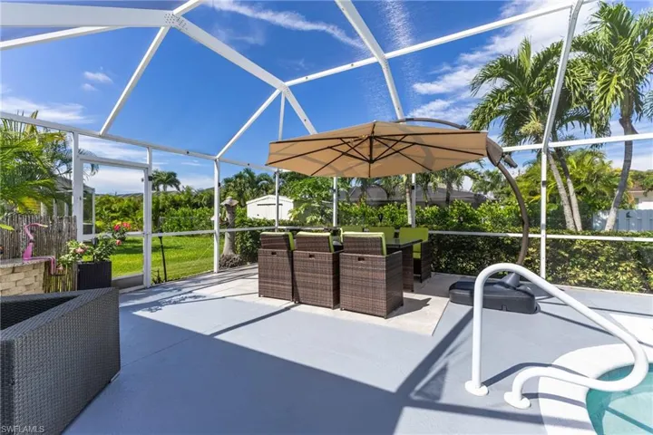View of patio featuring a sunroom, a lanai, and an outdoor hangout area