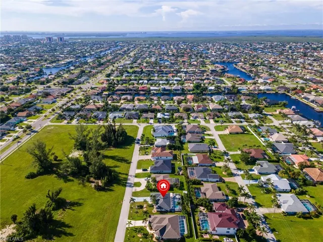 Aerial view of residential area with a large body of water
