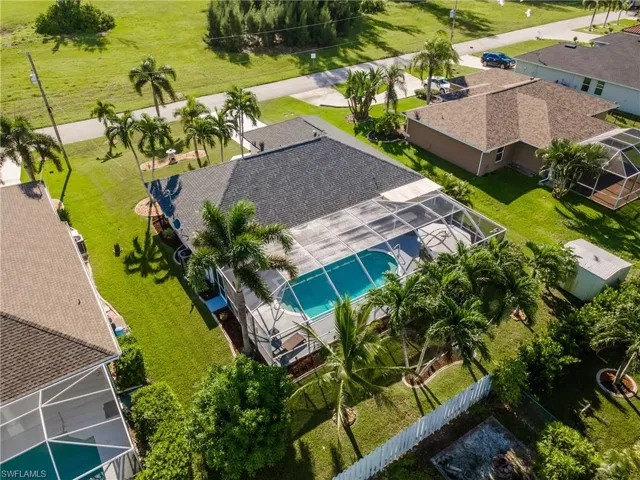Aerial view of residential area featuring a pool