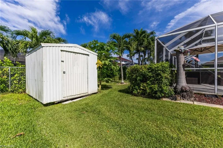View of yard featuring a storage unit