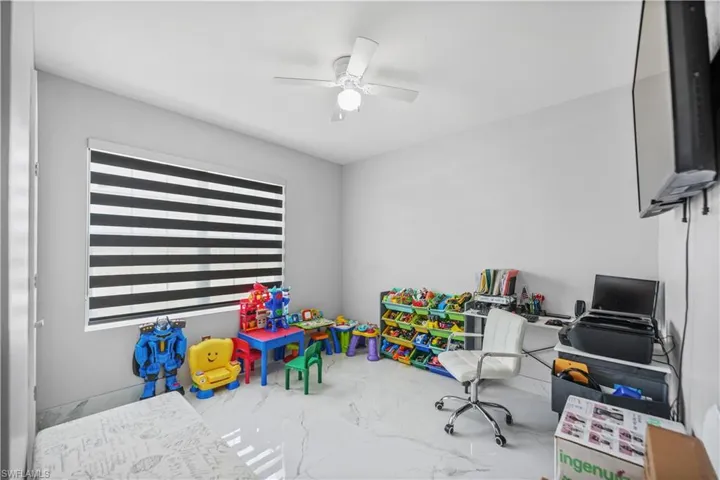 Office featuring plenty of natural light and ceiling fan