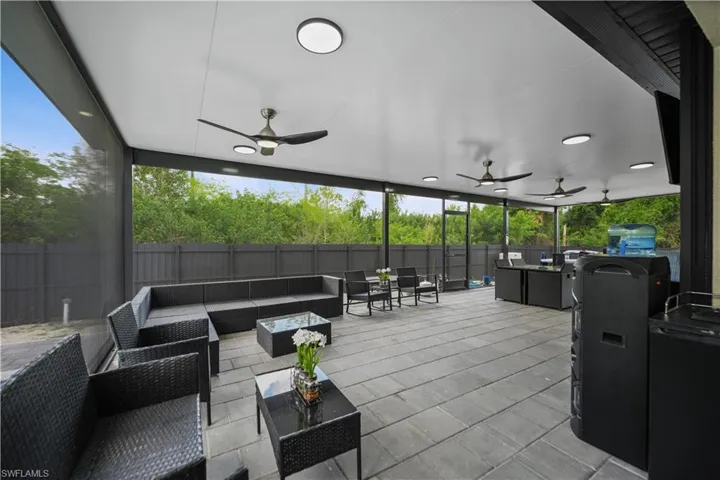 View of patio featuring ceiling fan and outdoor lounge area