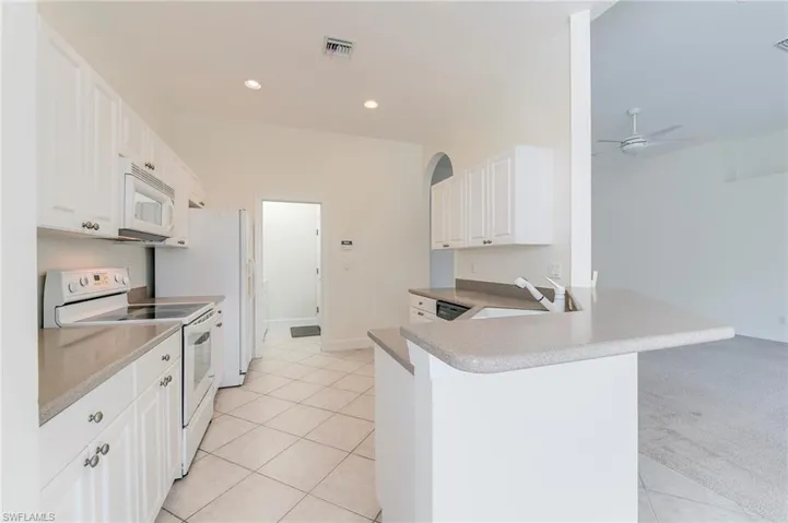 Door at rear to laundry and garage