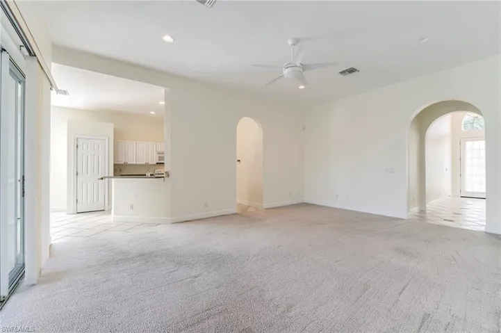 Family room.  Hall on right to den, guest bedroom and entry