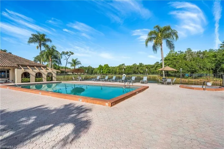 Community pool with a patio area