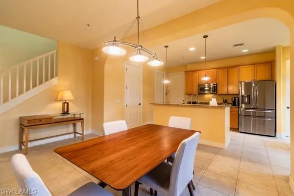 Tiled dining area with sink
