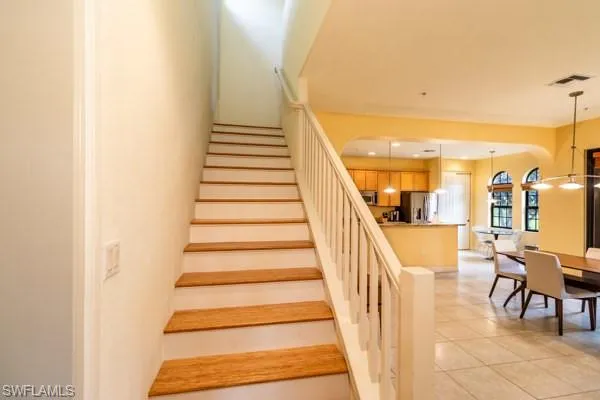 Stairway featuring tile patterned flooring