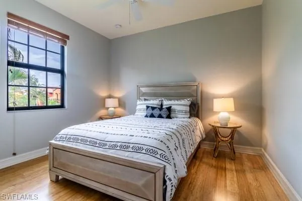 Bedroom featuring light hardwood / wood-style floors and ceiling fan