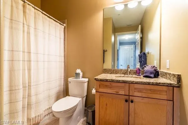 Bathroom with toilet and vanity