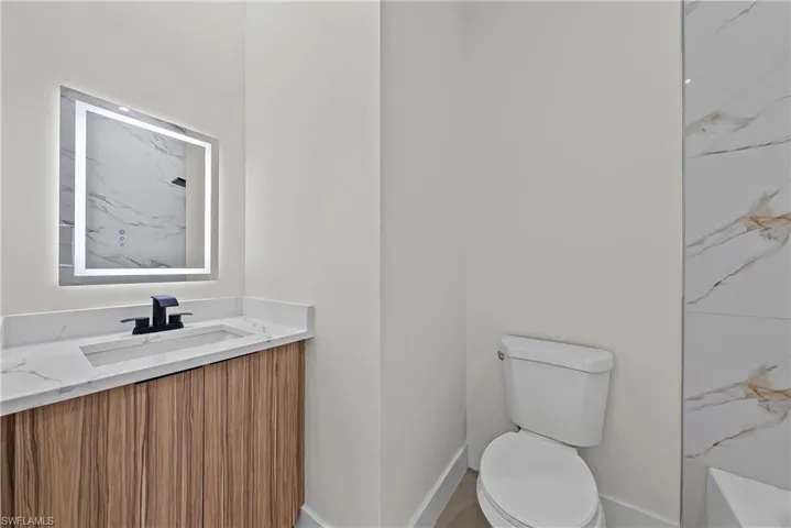 Bathroom with vanity and toilet