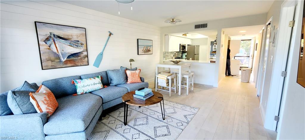 Open floor plan with beautiful shiplap wall