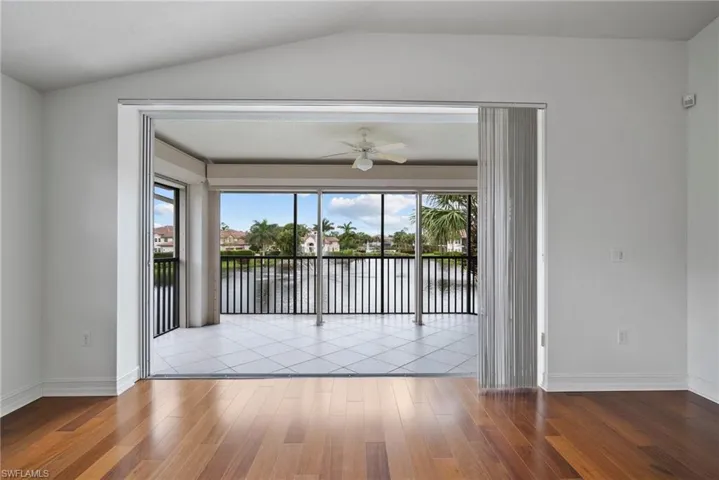 Unfurnished room with light hardwood / wood-style flooring, ceiling fan, and a wealth of natural light