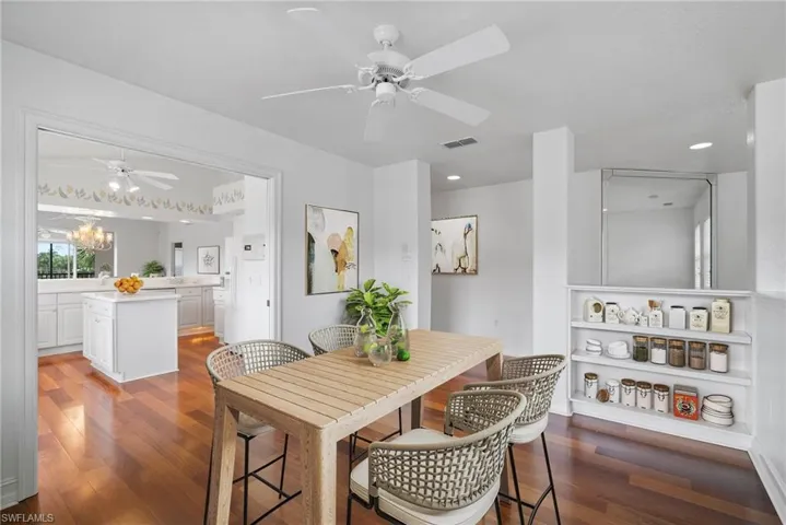 Dining room featuring an inviting chandelier and dark hardwood / wood-style flooring