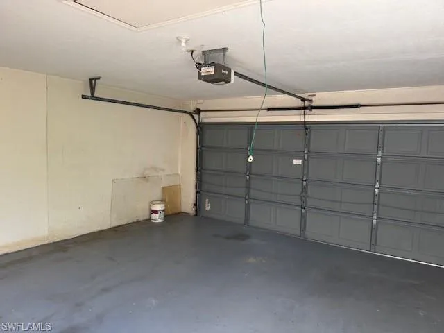 Garage featuring a garage door opener