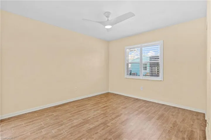 Empty room featuring light hardwood / wood-style floors and ceiling fan